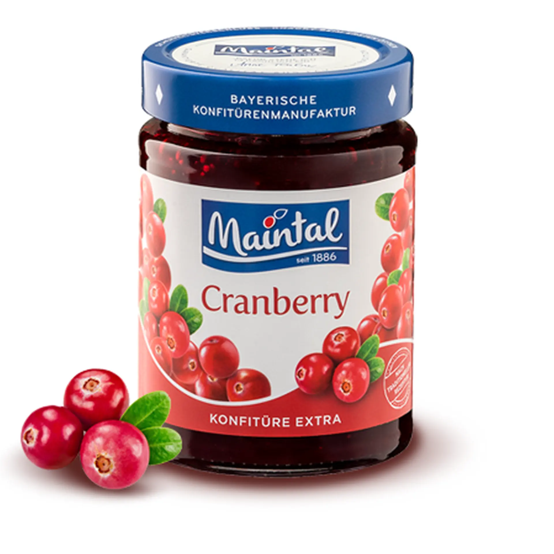 Cranberry-Konfitüre extra Glas Cranberry-Konfitüre extra, daneben Cranberries.