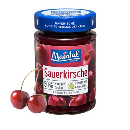 Sauerkirsch-Fruchtaufstrich, 50 % weniger Zucker Glas Sauerkirsch-Fruchtaufstrich, 50 % weniger Zucker, daneben zwei Kirschen