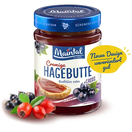 Glas Maintal Cremige Hagebutte mit Cassis, umgeben von Früchten, mit Hinweis „Neues Design – unverändert gut“.