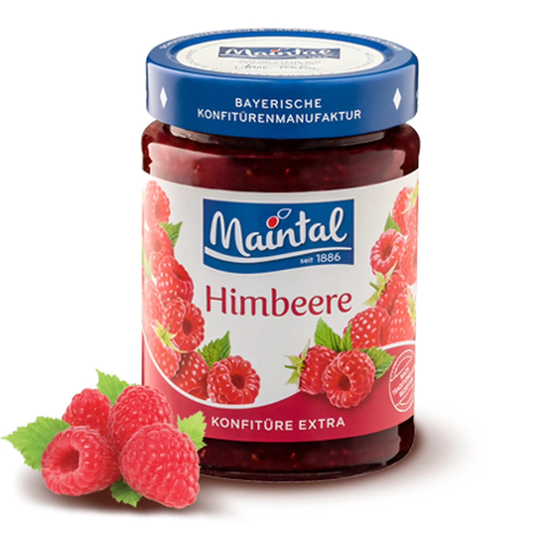 Himbeer-Konfitüre extra Glas Himbeer-Konfitüre extra, daneben Himbeeren.